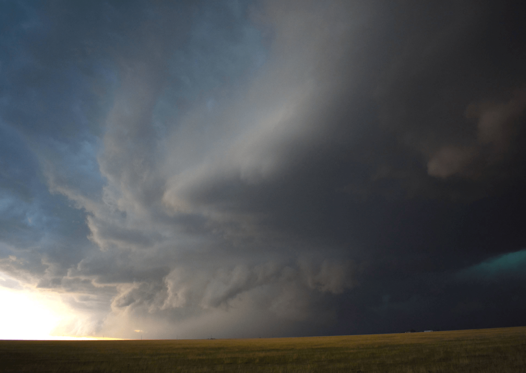 a storm cloud moving over the plains