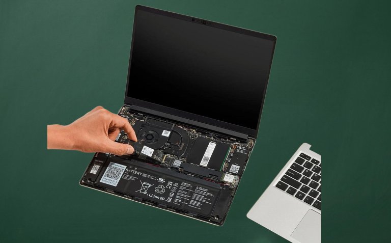 Framework 13 laptop with a hand adjusting the components