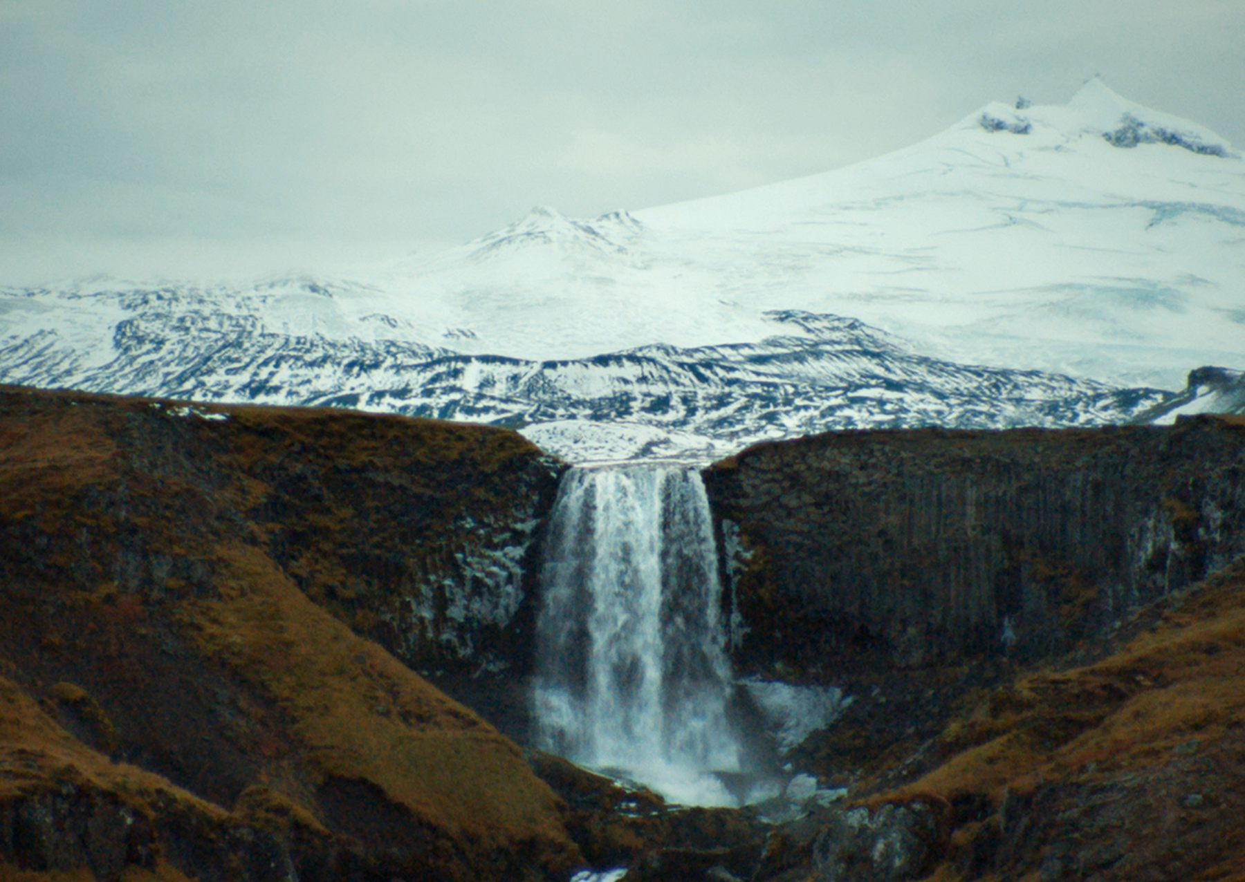 A glacial tongue behind a waterfall. Image: National Geographic.