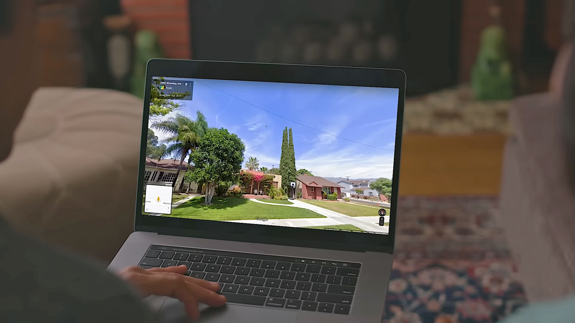 person using google streetview on computer