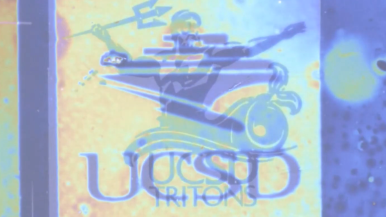 a message in invisible ink that reads UCSD with a man wielding a trident