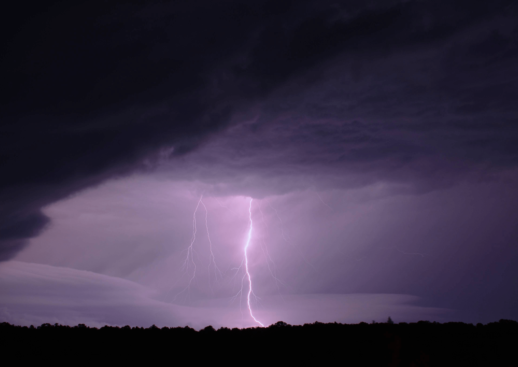 a lightning strike in a purple sky
