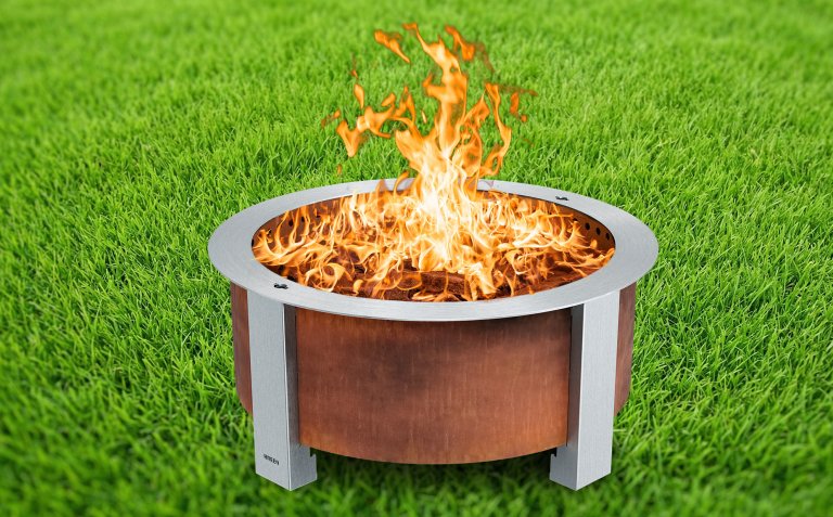 Breeo smokeless fire pit against a grass backdrop