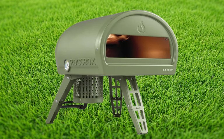 Gozney wood fired pizza oven against a grass backdrop