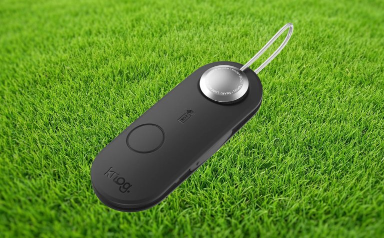 Knog travel tracker against a grass backdrop