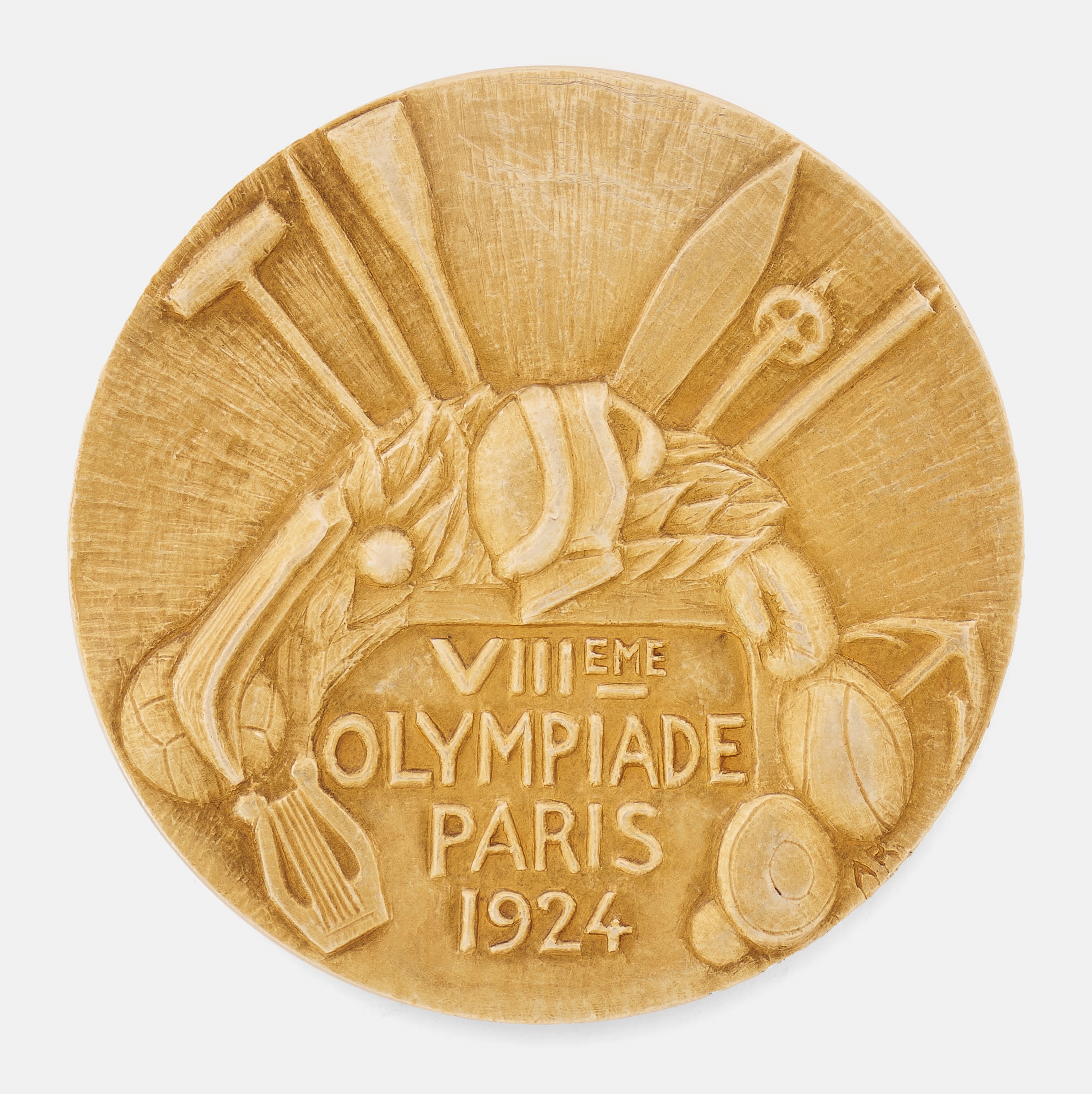 a gold medal from 1924. the text reads VIII EME OLYMPIADE PARIS 1924. symbols etched on the medal include a rugby ball, discus, and harp