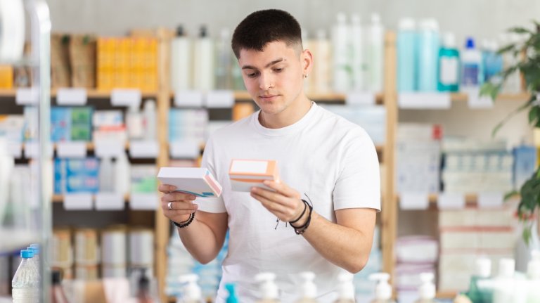 In sales area of pharmacy, guy examines packaging of tablets pills, reads characteristics and properties, checks expiration date and storage conditions.; Shutterstock ID 2610864833; purchase_order: PopSci; job: ; client: ; other: