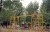 Vintage color photograph of two boys playing in public park featuring a playground.