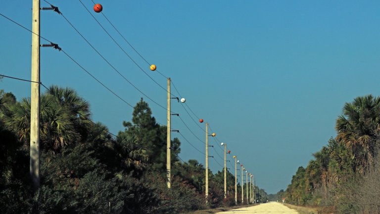Power line marker balls are used for safety of low flying aircrafts and to protect the electrical infrastructure. They make the power lines more visible especially during inclement weather.