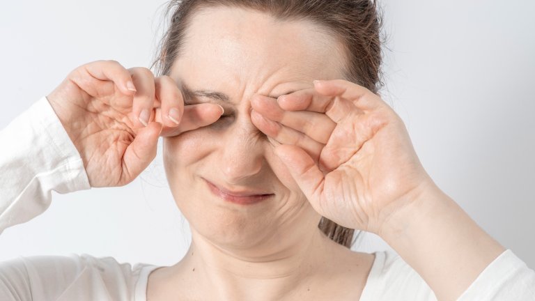 Woman rubs her eyes from fatigue. Poor vision, dry eyes. Hormonal imbalances in the female body, stress, poor sleep, allergy.; Shutterstock ID 2605950821; purchase_order: PopSci; job: ; client: ; other: