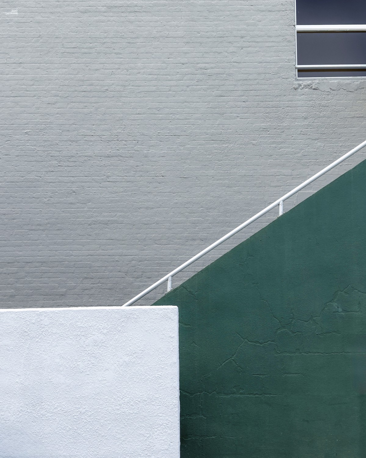 cement stairs on brick wall