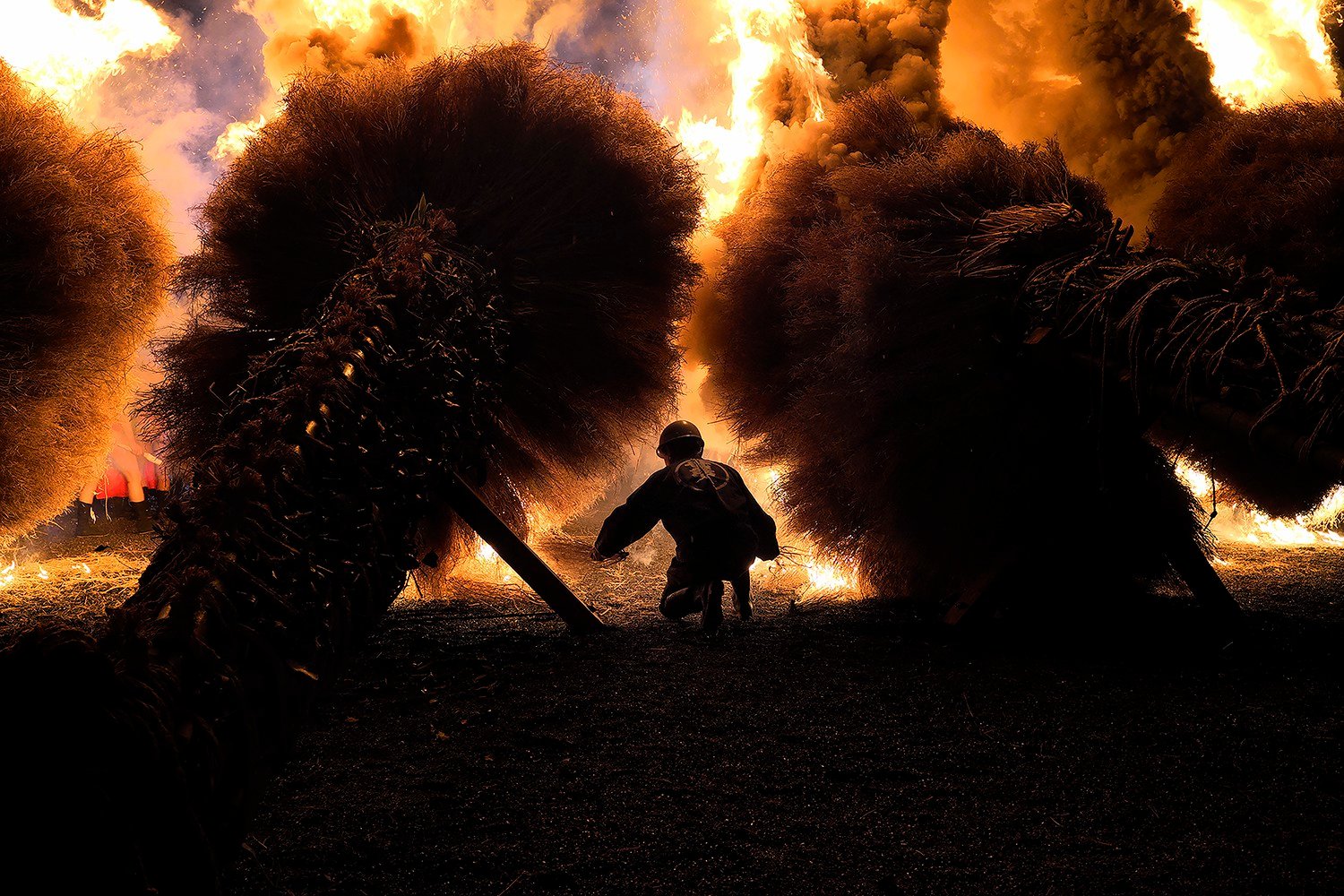 a fire fighter under flames