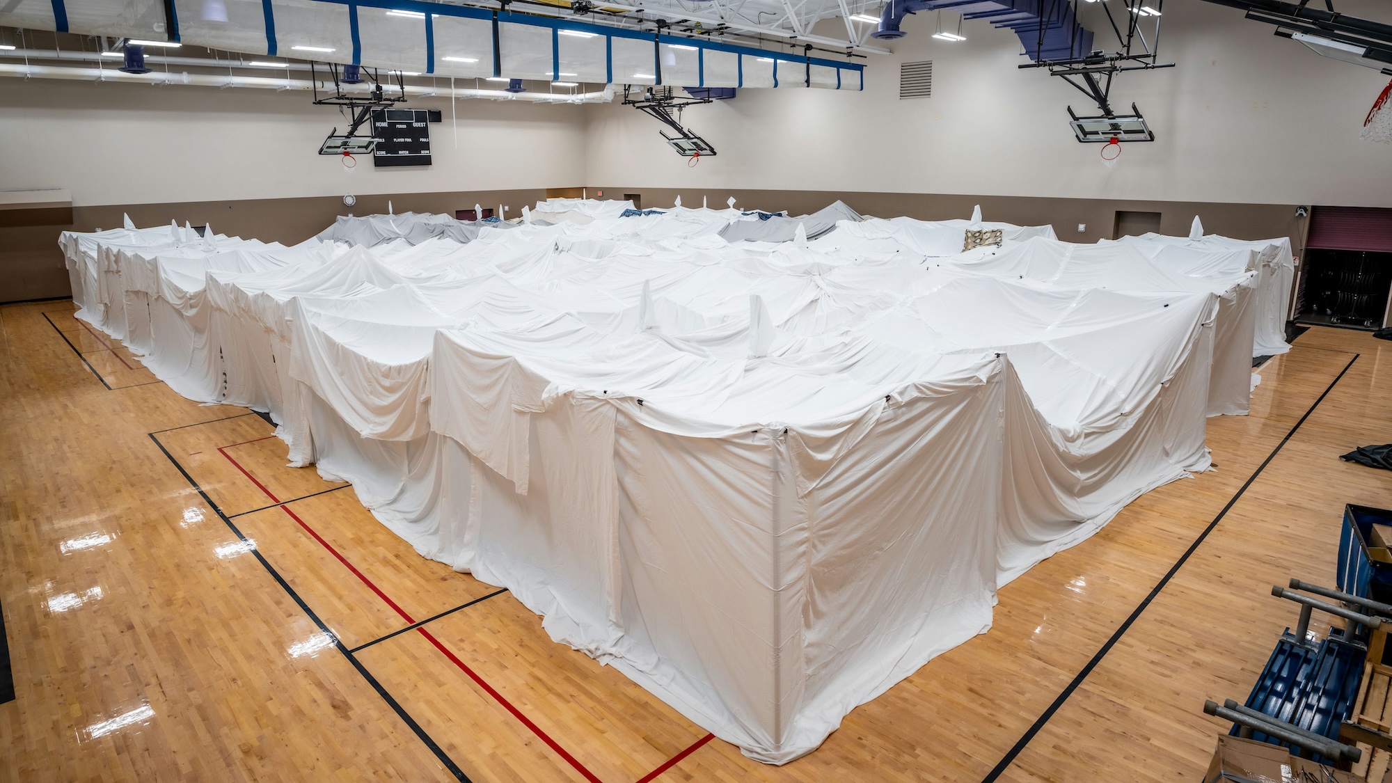 Blanket fort inside basketball gym