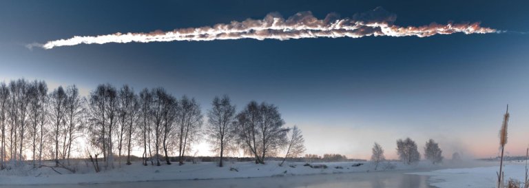 an asteroid in the sky with vapor