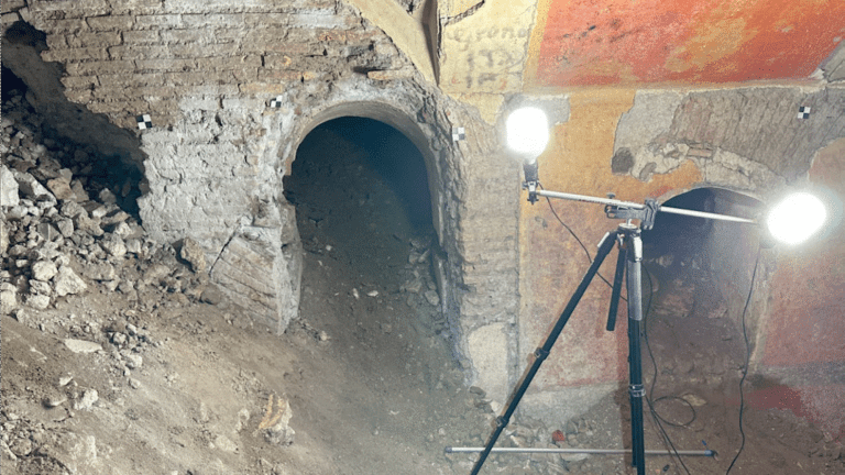 Roman underground ruins of home beneath school, illuminated by floodlights
