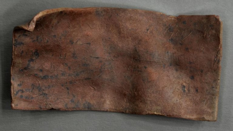 Photo of ancient Roman metal curse tablet