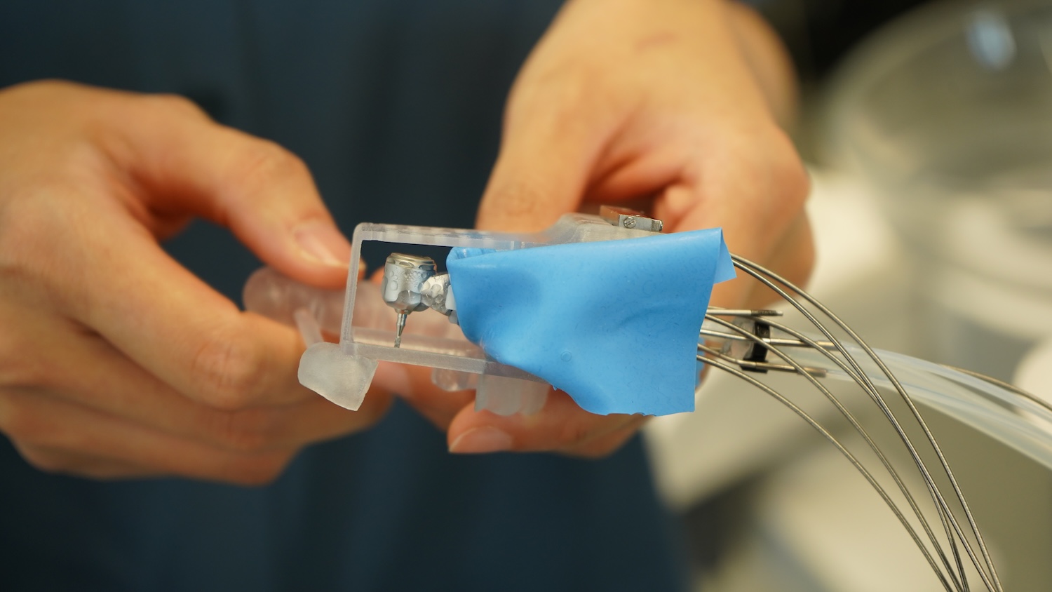 Close up of MIR dental robot attached to wires