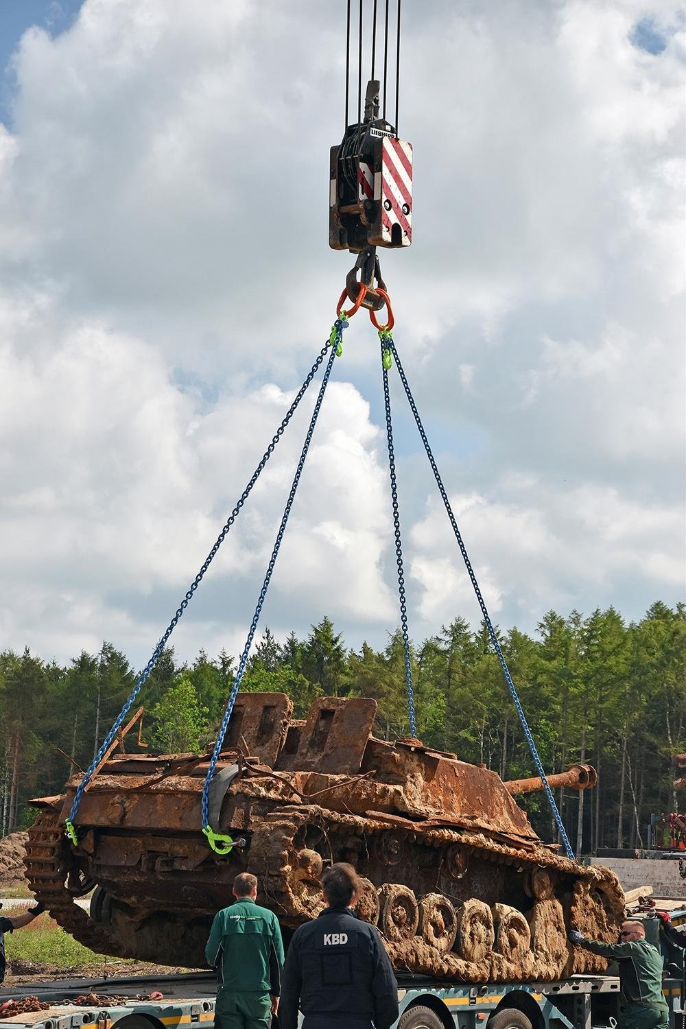 StuG III being lifted from excavation plot by a crane winch