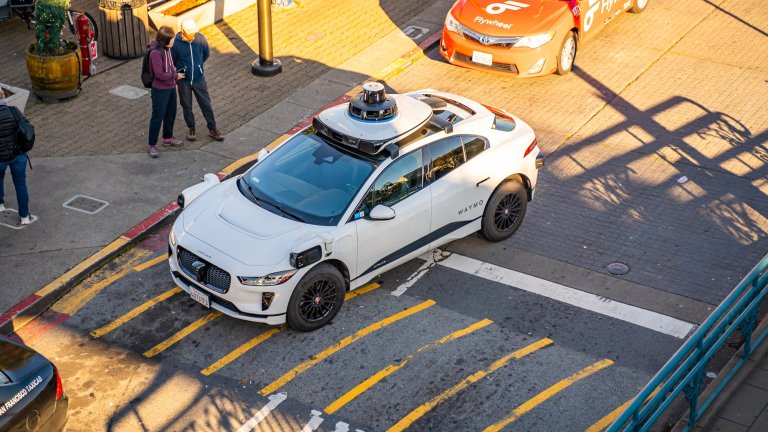 Aerial photo of Waymo self-driving taxi on street in San Francisco