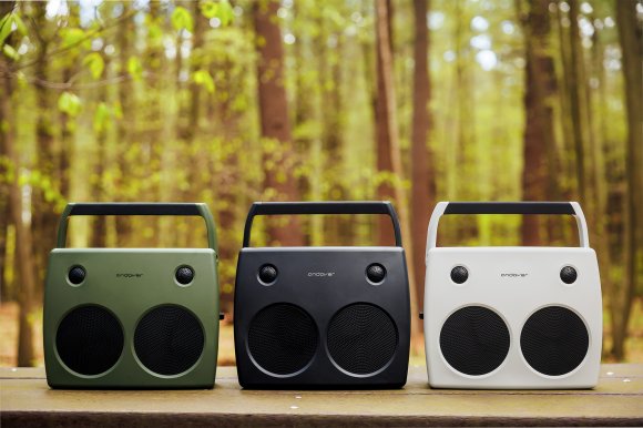 The Andover Sound FreePlay portable stereo Bluetooth speaker shown in Olive, Slate, and Ivory colorways against a woodland background