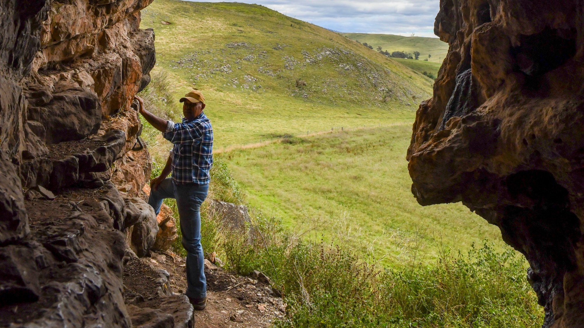 GunaiKurnai Elder Uncle Russell Mullett at the cave entrance of Cloggs Cave