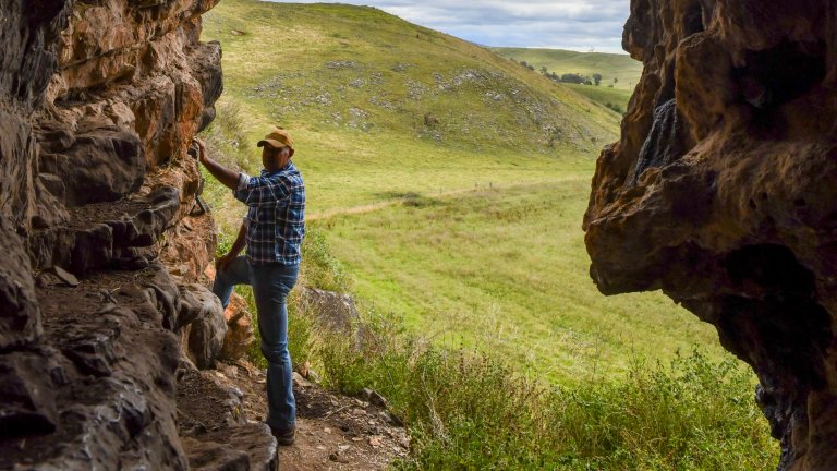 GunaiKurnai Elder Uncle Russell Mullett at the cave entrance of Cloggs Cave