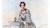 Woman in mid 1800s dress poses with an owl on a pedestal.