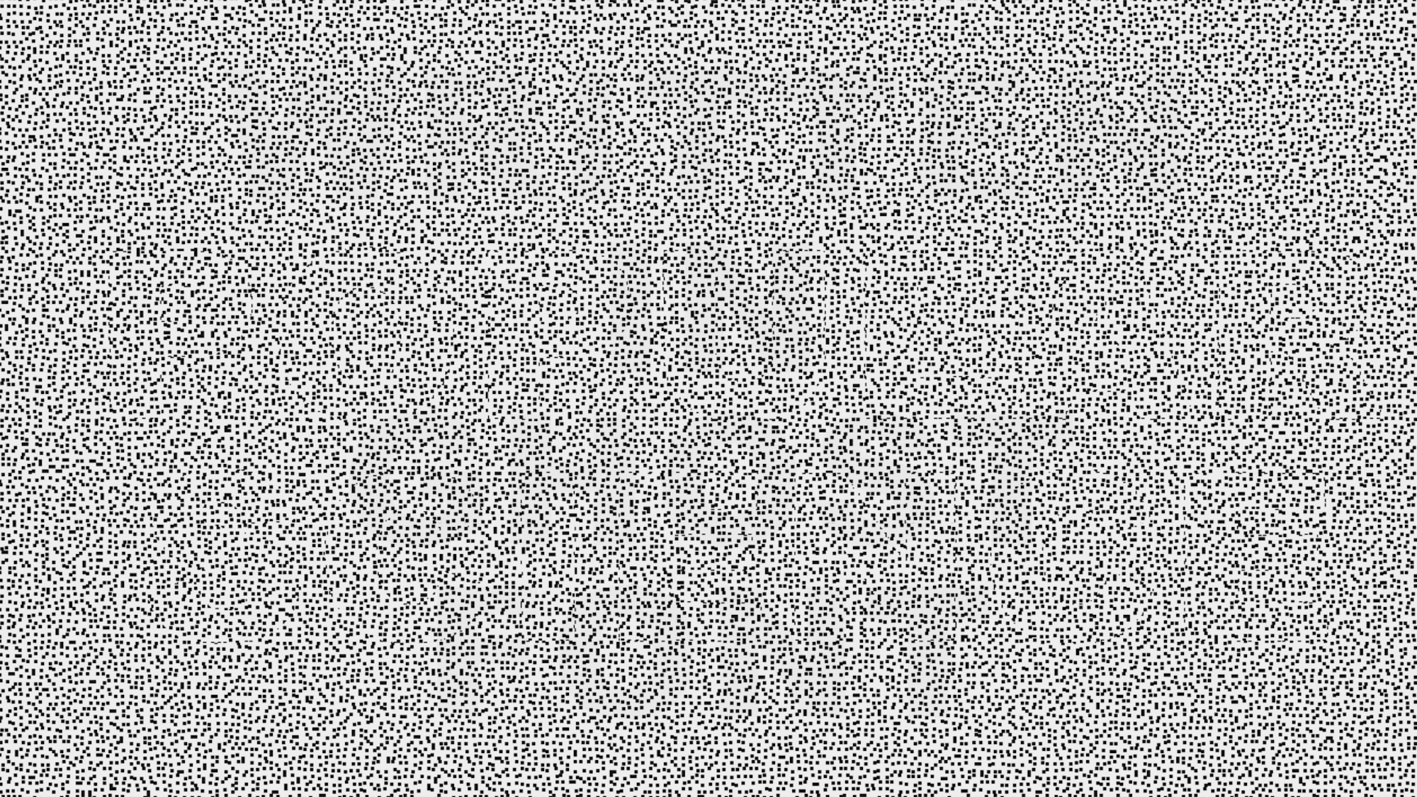 A screen filled with hundreds of randomly arranged dots. When animated, an optical illusion can reveal hidden words.