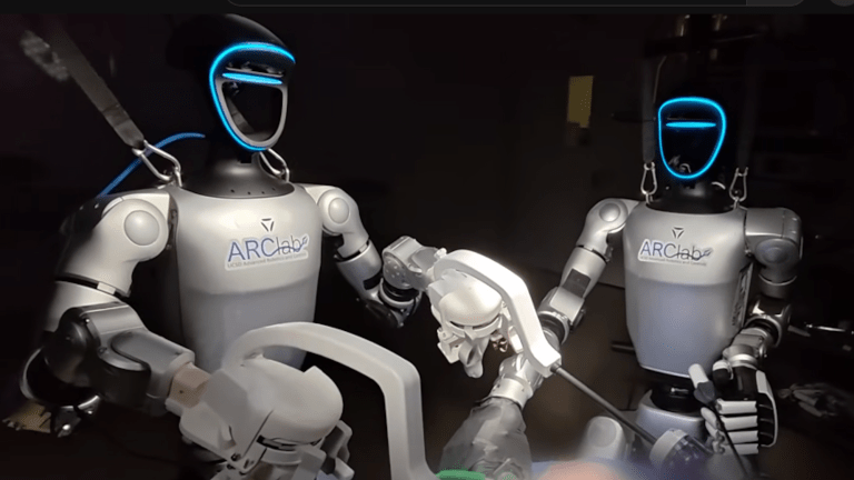 Two humanoid robots performing teleoperated surgery in operation room