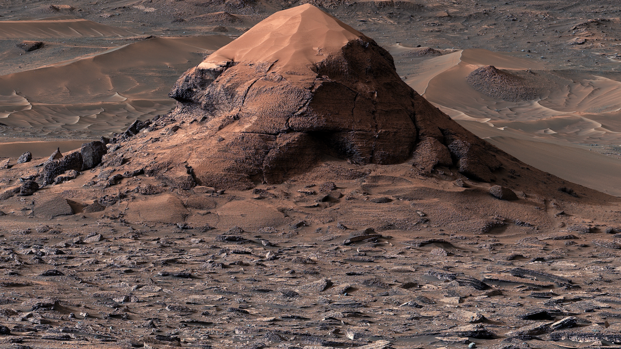 Martian butte surrounded by polygonal sediment formations