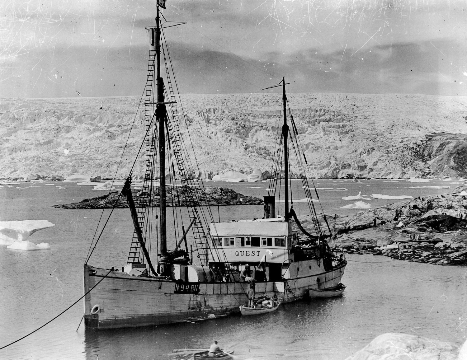 2HX6451 British Arctic Air Route Expedition - The Quest, the ship of the late Sir Ernest Shackleton, who died in the Antarctic, the expedition ship at the Base Fjord with glacier in the background. August 29, 1930. (Photo by British Arctic Air Route Expedition Photograph).