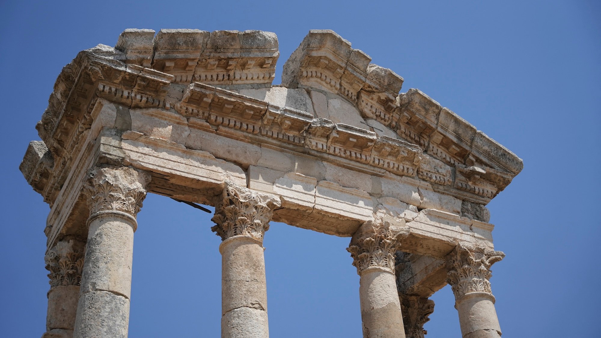 The ruins of the ancient city of Apamea are seen in the Hama countryside, Syria, on July 8, 2026. Apamea, founded in the Hellenistic period under the Seleucid Empire and later developed under Roman rule, was once one of the region’s major urban and military centers. The archaeological site is best known for its long Roman colonnaded street, theatre remains, mosaics, and other ruins that reflect the city’s importance in ancient Syria. (Photo by Omar Albam / Middle East Images via AFP)