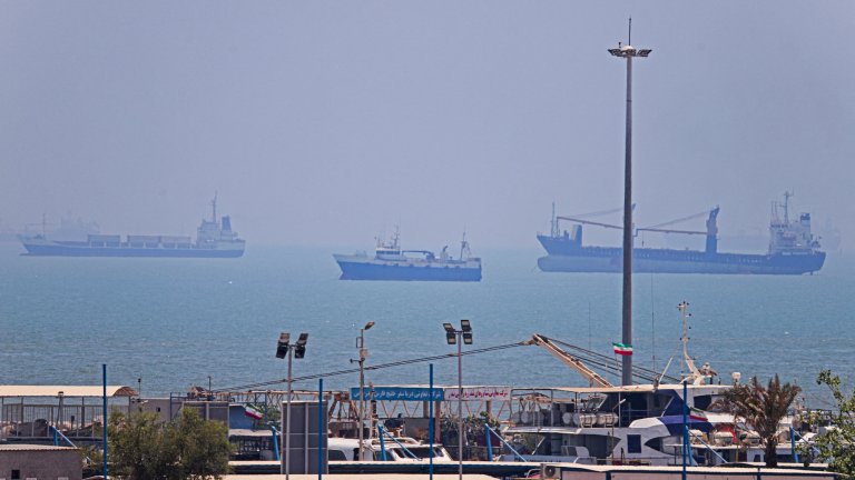 In this picture obtained from Iran's ISNA news agency on June 18, 2026, vessels are seen anchored in Bandar Abbas along the Strait of Hormuz. Oil prices tumbled after Trump and his Iranian counterpart separately signed their accord to end the Middle East war, with the Strait of Hormuz to reopen but two months of negotiations lying ahead. (Photo by AMIRHOSSEIN KHORGOOEI / ISNA / AFP) /