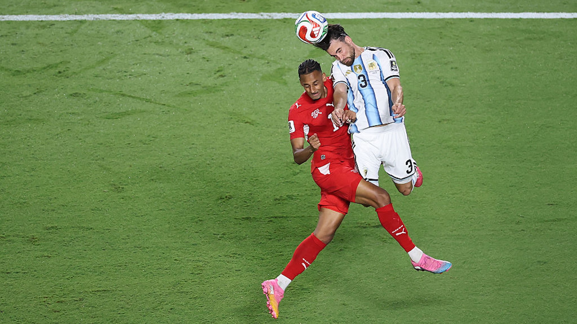 KANSAS CITY, MISSOURI - JULY 11: Nicolas Tagliafico #3 of Argentina wins a header against Djibril Sow #15 of Switzerland during the FIFA World Cup 2026 Quarter Final match between Argentina and Switzerland at Kansas City Stadium on July 11, 2026 in Kansas City, Missouri. (Photo by Hector Vivas - FIFA/FIFA via Getty Images)