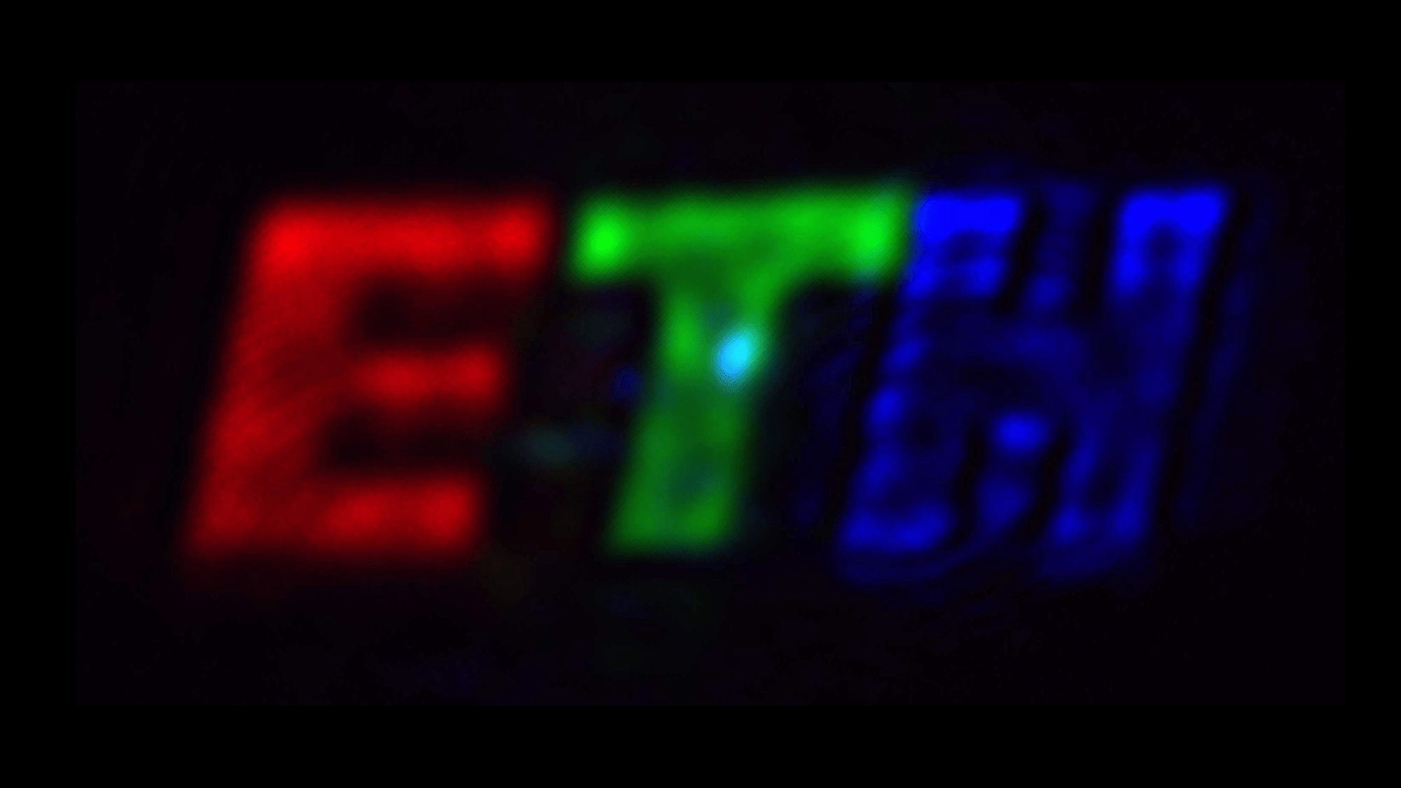 the letters ETH in new pixels. the e is red, the t is green, and the h is blue