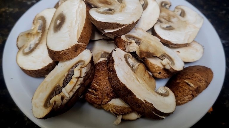 Plate of sliced mushrooms.