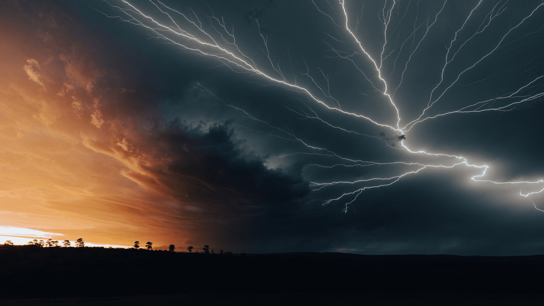 lightning bolts across the sky at sunset, Eastern Cape, South Africa.