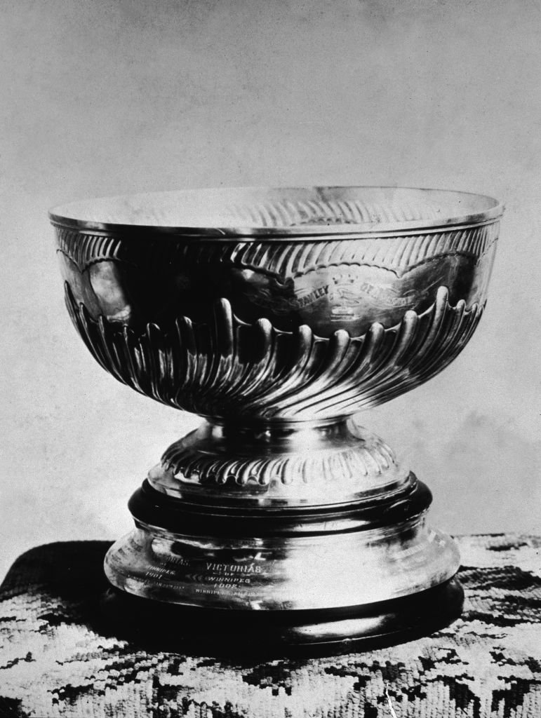 Photograph of the Stanley Cup, addressed to the Winnipeg Victorias, 1902. Shaped like a bowl mounted on a pedestal, the Cup was first presented in 1893, originally intended for the top amateur hockey team in Canada. 