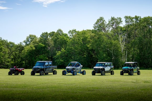 The Polaris Off Road 2027 lineup in a field, including Sportsman 500, XPEDITION, and RZR Pro R Boost models