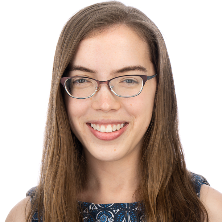 a photo of a woman with long brown hair and glasses