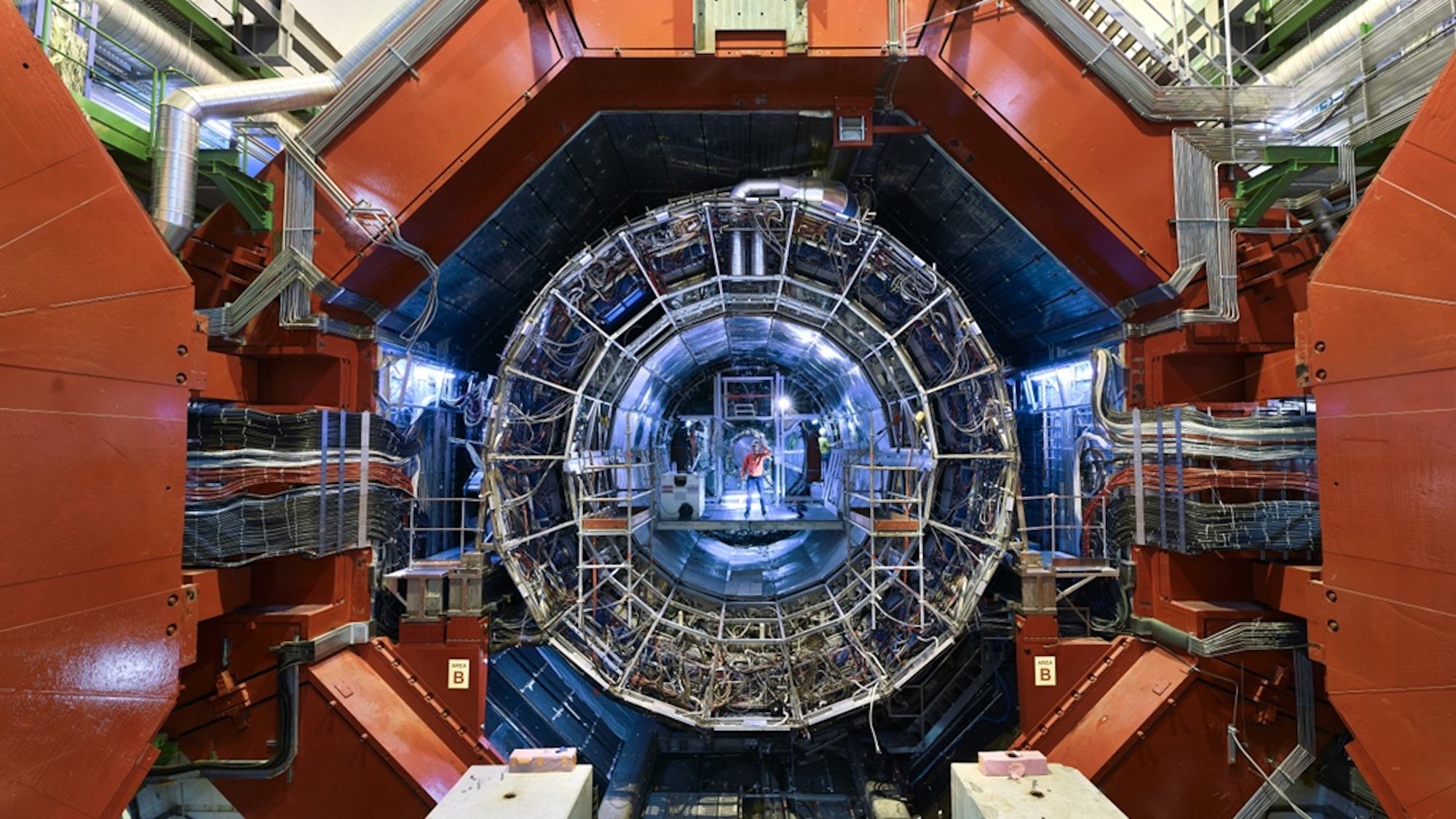 Scientists standing inside ALICE collider at CERN