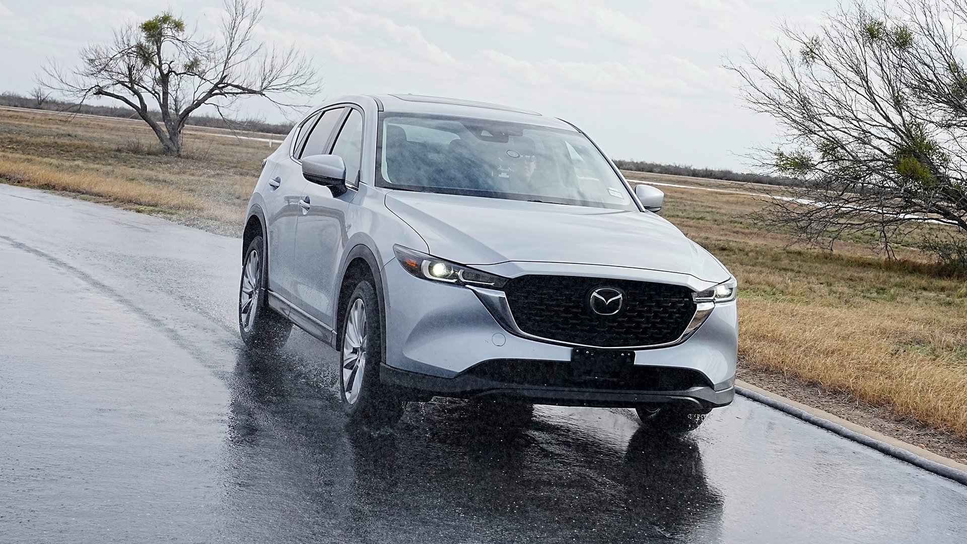 Silver SUV driving in the rain