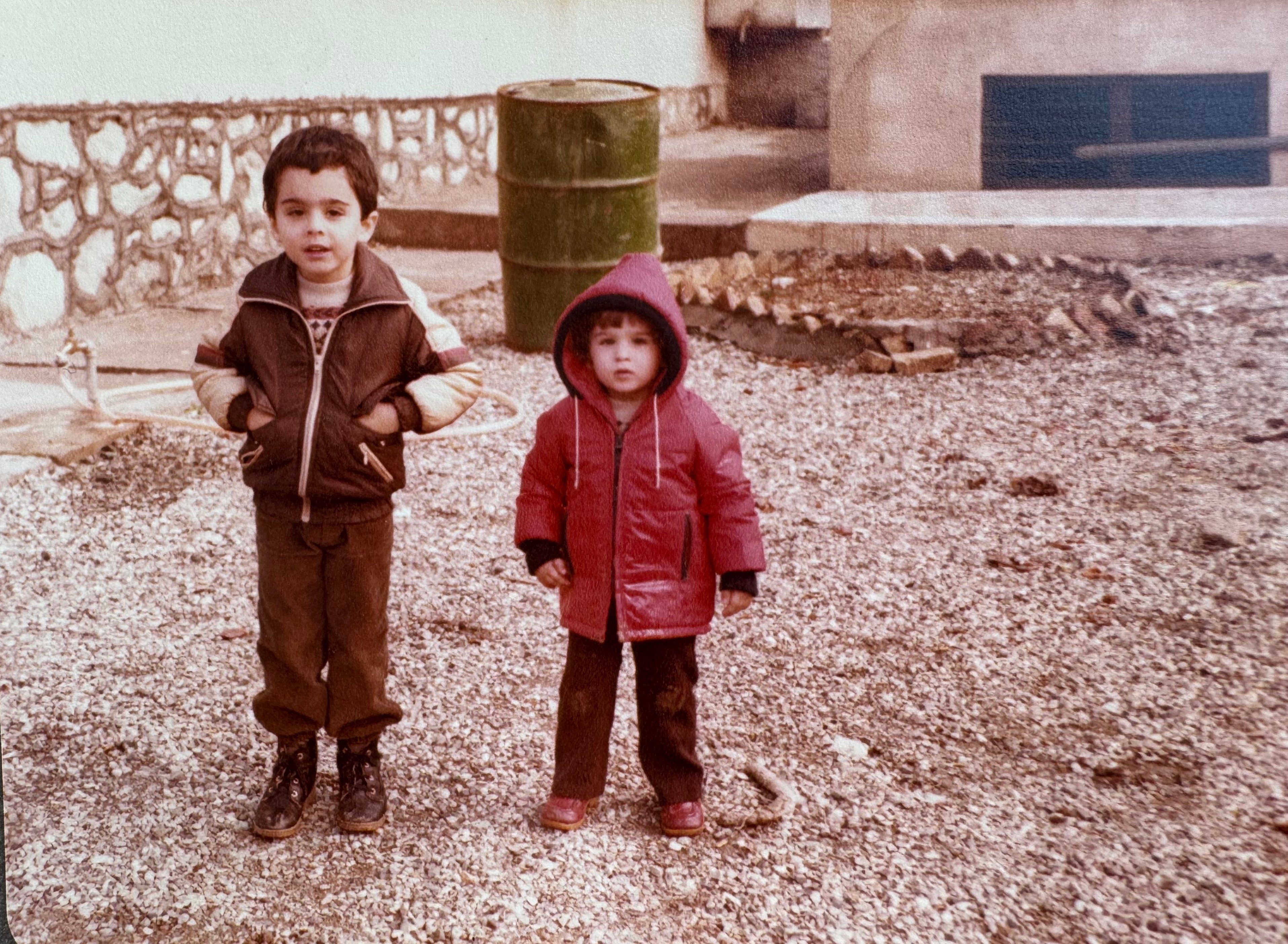 two children standing on the ground
