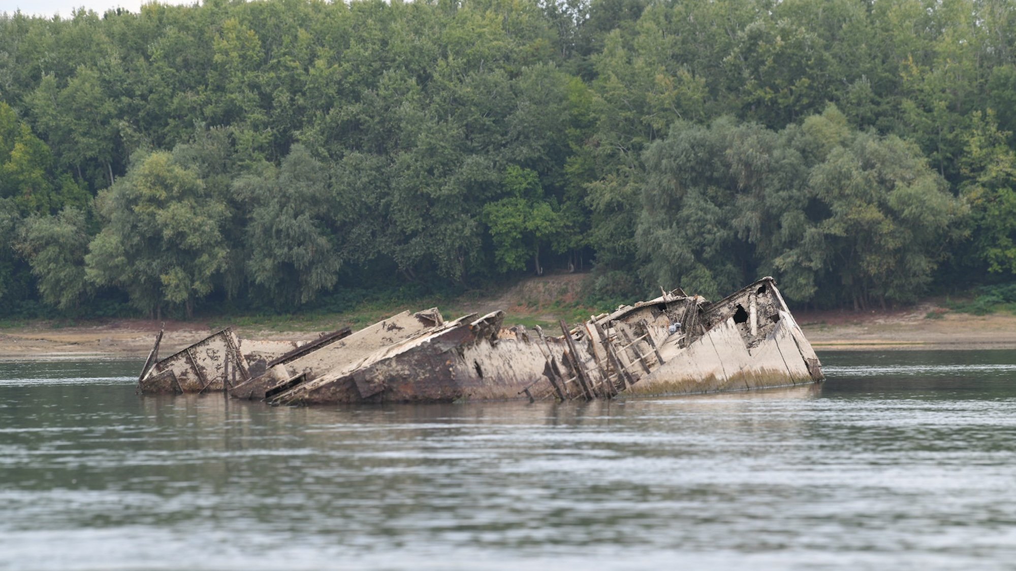 NEGOTIN, SERBIA - SEPTEMBER 13: A view of the wreckage of German warship, in Negotin, Serbia on September 13, 2024. A German warship, dating back to World War II, has resurfaced in Serbia's Danube River near the eastern village of Prahovo in the Negotin region due to receding water levels caused by recent extreme heat. The vessel is believed to be part of Nazi Germany's Black Sea fleet, which was abandoned by retreating German forces in 1944 as the Soviet army advanced. (Photo by Amir Hamzagic/Anadolu via Getty Images)