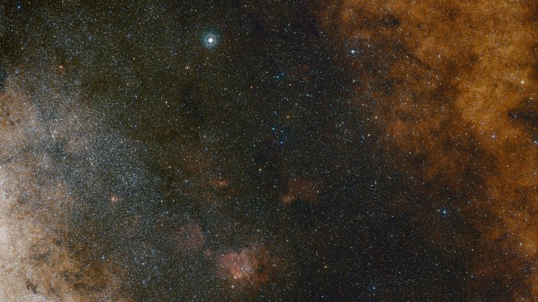 This visible light wide-field view shows the rich star clouds in the constellation of Sagittarius (the Archer) in the direction of the centre of our Milky Way galaxy. The entire image is filled with vast numbers of stars — but far more remain hidden behind clouds of dust and are only revealed in infrared images. This view was created from photographs in red and blue light and form part of the Digitized Sky Survey 2. The field of view is approximately 3.5 degrees x 3.6 degrees.