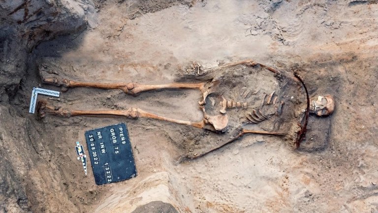17th century skeleton of a young woman in burial plot in Poland