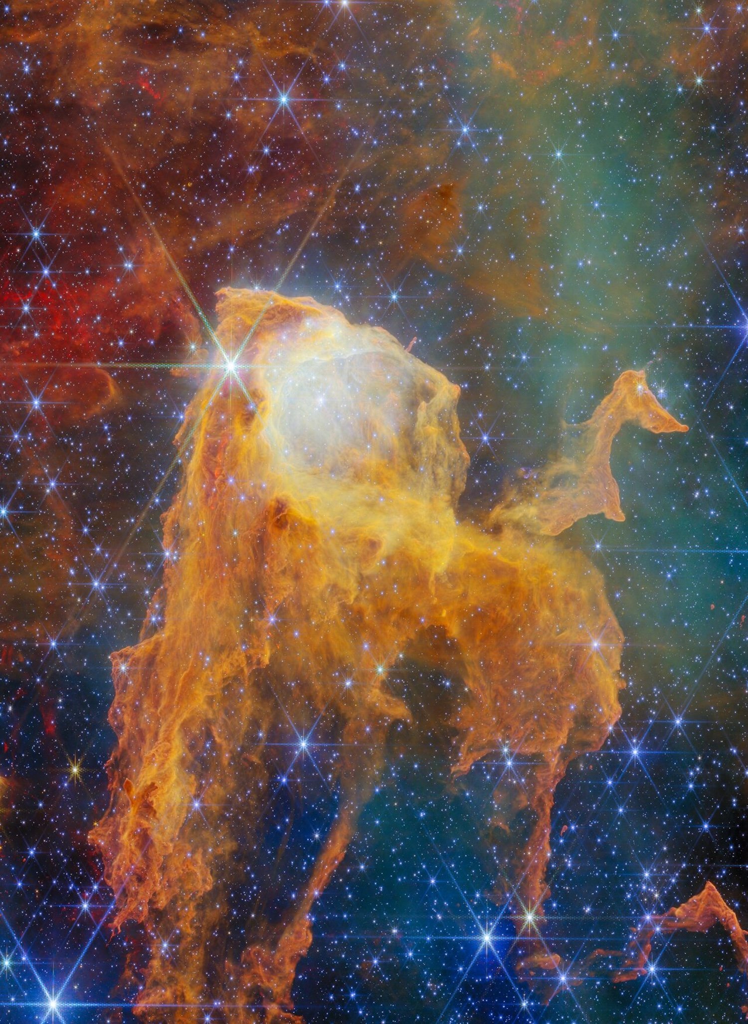 This NASA/ESA/CSA James Webb Space Telescope Picture of the Month takes us to a fantastical realm within our home galaxy, where piercing starlight and billowing winds sculpt dust clouds into inventive shapes. This scene is from the Carina Nebula, which lies just 7500 light-years away in the constellation Carina (the Keel). Spanning roughly 260 light-years, the nebula is home to an incredible collection of objects, including the Cosmic Cliffs revealed in the first-ever Webb image release. The Carina Nebula is also the nearest high-mass star-forming region that allows astronomers to study the full range of star formation. This nebula houses some of the most massive stars in our galaxy as well as tens of thousands of protostars, offering a valuable opportunity to understand how stars shape their neighbourhoods. The feature highlighted in today’s image, aptly called the Treasure Chest, looks right at home in this celestial sculpture garden. The Treasure Chest is what’s known as a cometary globule. A cometary globule is an isolated cloud of gas and dust with a dense, dark head and a sweeping tail. These clouds often somewhat resemble comets, but the Treasure Chest looks distinctly like a wooden chest with its lid wide open. However, this chest doesn’t contain jewels or gold coins, but instead a compact cluster of young stars. These stars are responsible for the otherworldly glow coming from within the Treasure Chest, revealed by Webb’s sensitive Near-Infrared Camera (NIRCam). Researchers estimate that the Treasure Chest’s cluster contains about 70 stars, the most massive of which is a rare O-type star roughly 19 times as massive as the Sun. The star cluster is likely around 1.3 million years old, though earlier estimates found it to be as young as just 100 000 years old. Because of its youth, the cluster is still deeply embedded within the dusty clouds of the Treasure Chest. The individual stars in the cluster are wrapped up in dust as well; astronomers have found evidence that many of these stars are surrounded by circumstellar discs. Over time, the brilliant starlight from these young stars will dissipate the surrounding cloud and reveal the entire cluster. The key to the Treasure Chest’s sculptural shape lies outside this image: just 39 light-years to the northwest, as measured on the sky, sits Eta Carinae, the most luminous object in the entire Carina Nebula. Eta Carinae is a star system containing at least two stars, one of which is 100 times as massive as the Sun. This star alone is about 5 million times as luminous as the Sun. Adding to this intense radiation is the nearby star cluster Trumpler 16, which also contains several extremely hot massive stars. The radiation and winds from these massive stars are largely responsible for the current appearance of the Treasure Chest, though the star cluster embedded within it is also eating away at the cloud from within. There’s some debate as to which came first, the cometary shape of the cloud or the star cluster it contains. The likeliest scenario suggests that the star cluster formed first in a cloud of gas that was larger than the Treasure Chest is today. Then, the powerful stellar feedback from nearby stars whisked away the less-dense gas, leaving behind only the denser gas that makes up the Treasure Chest. With Webb, astronomers have carried out an observing programme (#5408; PI: Reiter) dedicated to studying how young stars in the Carina Nebula collect gas from their surroundings and expel it through outflows. These observations from Webb will help astronomers understand how young stars impact their environments, allowing them to craft spectacular scenes like this one. [Image Description: A region of space filled with bright stars and clouds of gas. In the centre, the densest clouds form the shape of a chest with its lid open. The chest appears to glow from within. At its base it breaks apart into long pillars of thick gas. Many of the gas clouds in the background are dark orange globules, while others form large, pale hazes. A few brightly shining stars lie in the foreground, the biggest and brightest in front of the chest’s lid.] Links Image on ESA website Pan Video Zoom Video