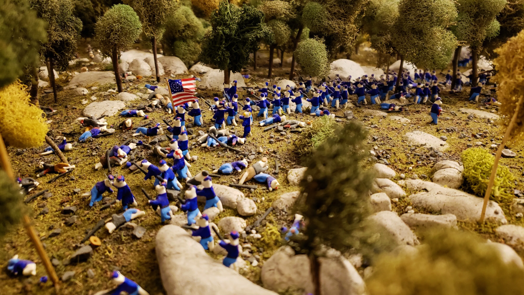 The Battle of Gettysburg, as depicted by clay cats. The 140th New York (right) arrives and the 20th Maine (left) charges, pushing the Confederates back. The fight eventually ends on Little Round Top.