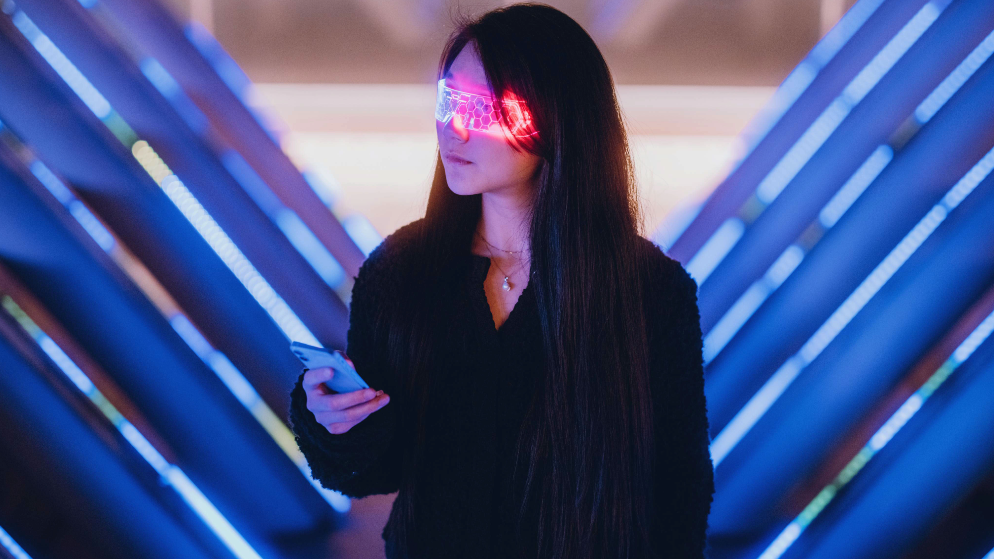 a woman wearing glasses with red lights on them