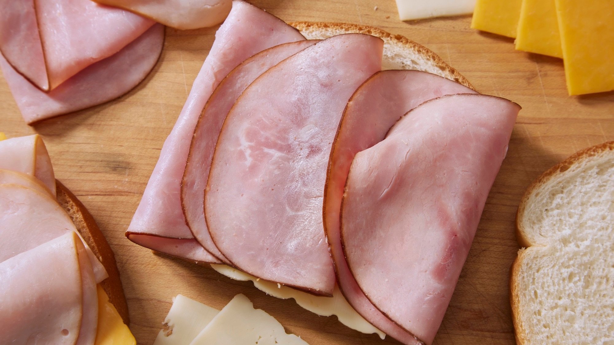 Preparing a Monte Cristo Sandwich, with Black Forest Ham, Smoked Turkey Breast, Cheddar and Swiss Cheese